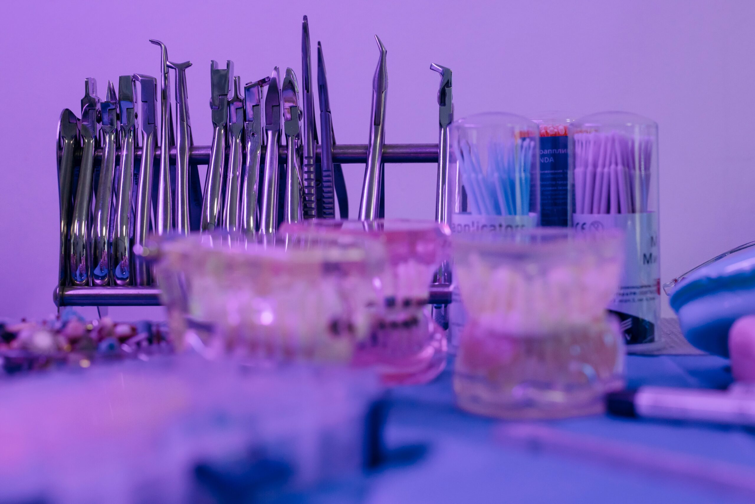 Close-up of various dental equipment in a dentist's clinic showcasing tools and models.